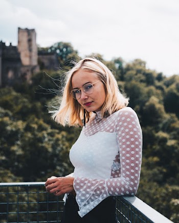 Photo of Woman Wearing Eyeglasses
