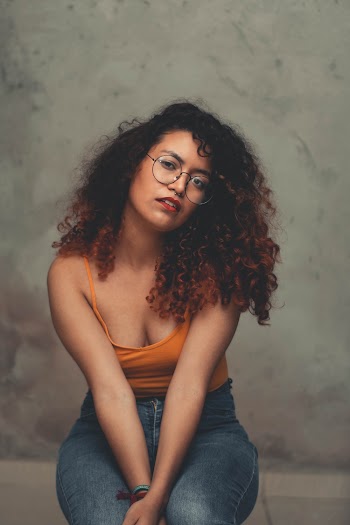 Photo of Woman Wearing Eyeglasses