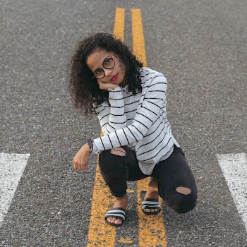Photo of Woman Wearing Eyeglasses With Red Lips