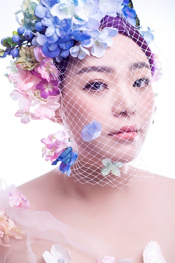 Photo of Woman Wearing Floral Headdress
