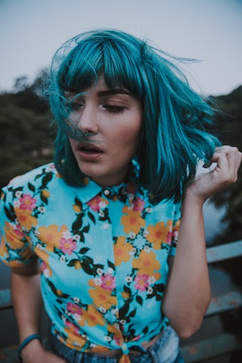 Photo of Woman Wearing Floral Shirt