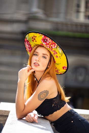 Photo of Woman Wearing Floral Sun Hat