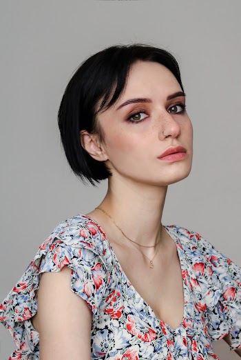 Photo Of Woman Wearing Floral Top