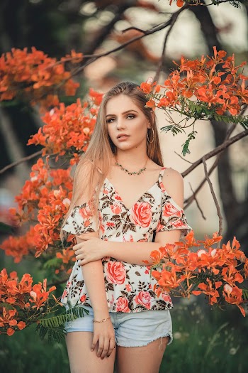 Photo Of Woman Wearing Floral Top