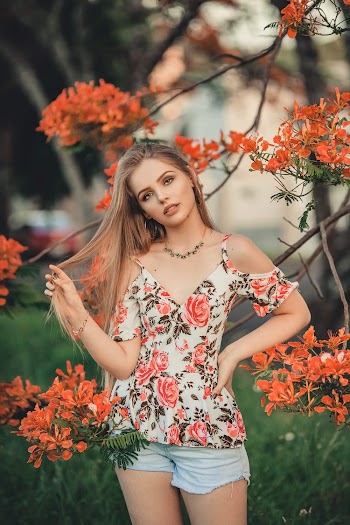 Photo Of Woman Wearing Floral Top