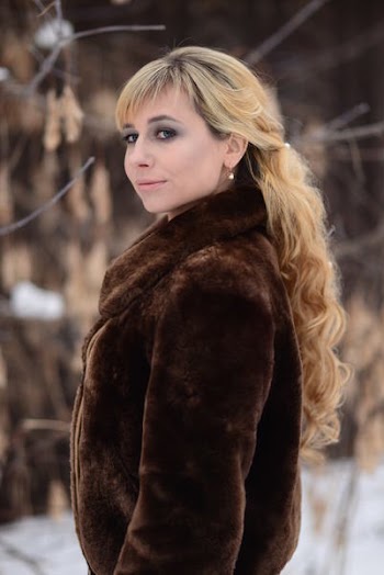 Photo of Woman Wearing Fur Coat