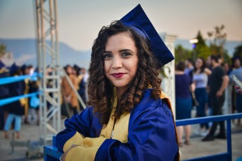 Photo of Woman Wearing Graduation Dress