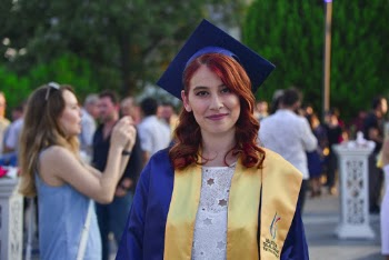 Photo of Woman Wearing Graduation Dress