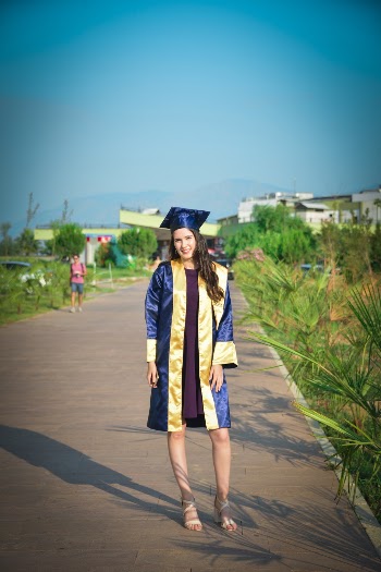 Photo Of Woman Wearing Graduation Gown