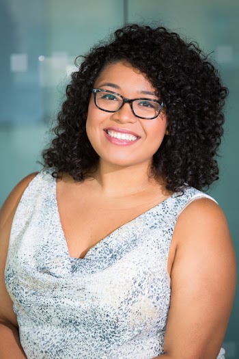 Photo of Woman Wearing Gray and Black Plunge Sleeveless Top