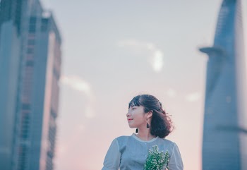 Photo of Woman Wearing Gray Button-up Top