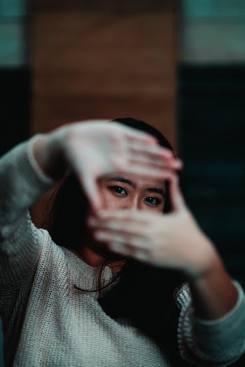 Photo of Woman Wearing Gray Sweater