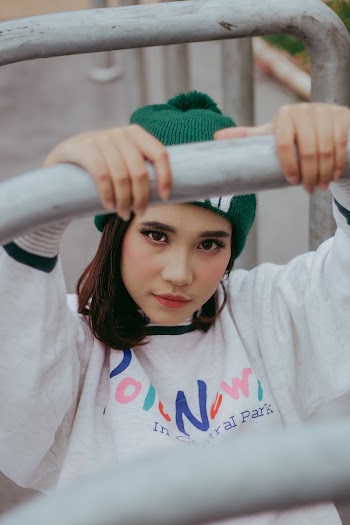 Photo Of Woman Wearing Green Bonnet