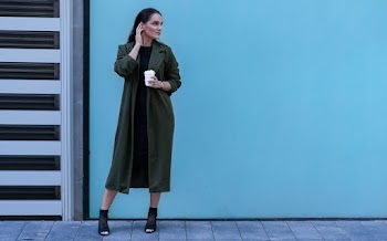 Photo Of Woman Wearing Green Coat