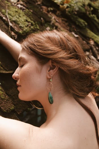Photo Of Woman Wearing Green Earinggs
