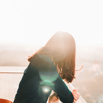 Photo of Woman Wearing Green Sweater