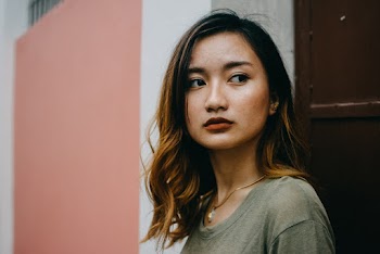 Photo of Woman Wearing Grey Shirt