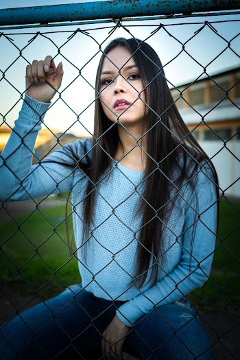 Photo of Woman Wearing Grey Sweater