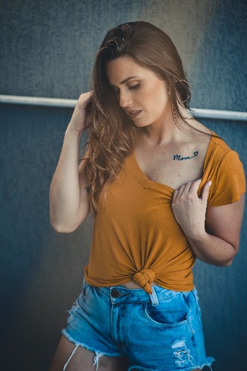 Photo of Woman Wearing Jean Shorts