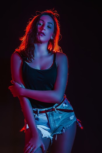 Photo of Woman Wearing Jean Shorts