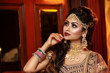 Photo of Woman Wearing Jewelries While Looking Upward 
