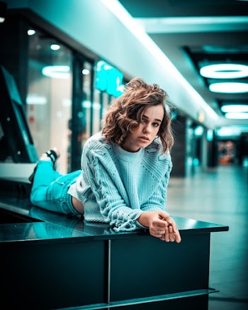 Photo of Woman Wearing Knitted Sweater