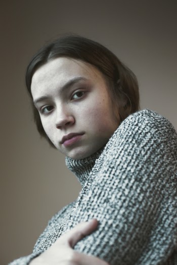 Photo of Woman Wearing Knitted Sweater