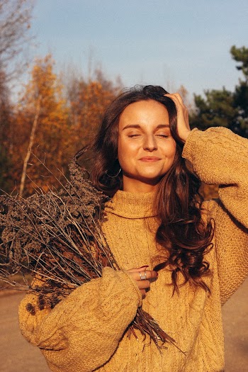Photo of Woman Wearing Knitted Sweater