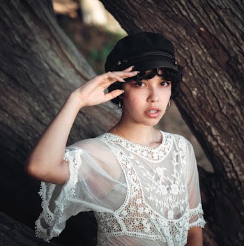 Photo Of Woman Wearing Laced Top