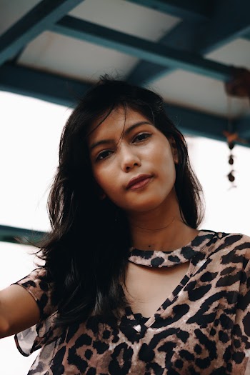 Photo of Woman Wearing Leopard Print Top