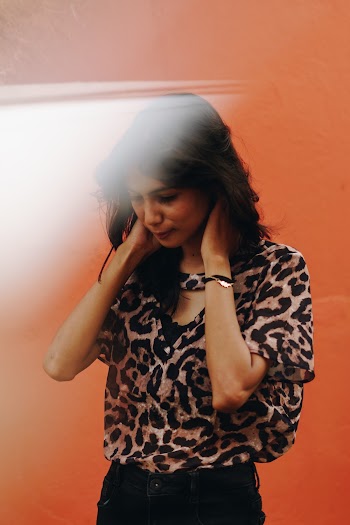 Photo of Woman Wearing Leopard Print Top