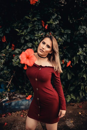Photo of Woman Wearing Maroon Dress