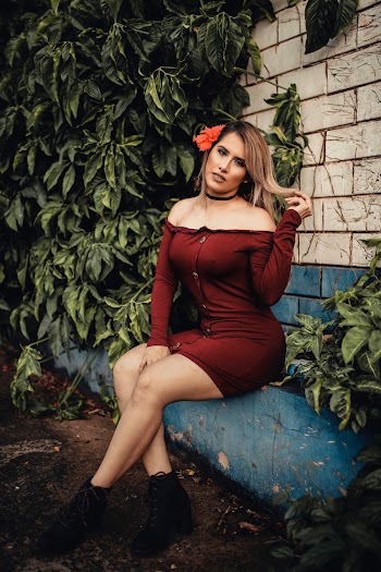 Photo of Woman Wearing Maroon Dress