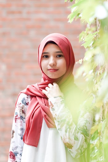 Photo of Woman Wearing Maroon Hijab