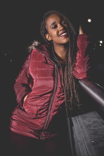 Photo of Woman Wearing Maroon Jacket