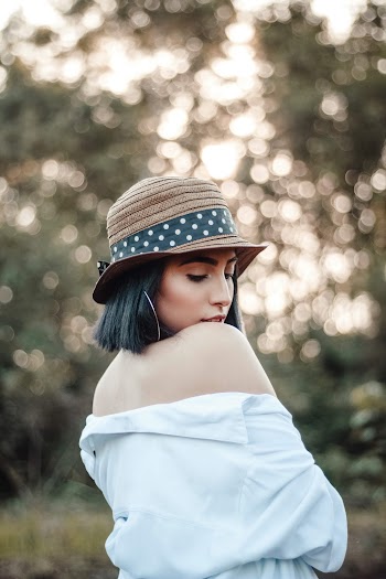 Photo of Woman Wearing Off-Shoulder Top