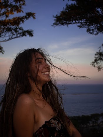 Photo of Woman Wearing Off Shoulder Top