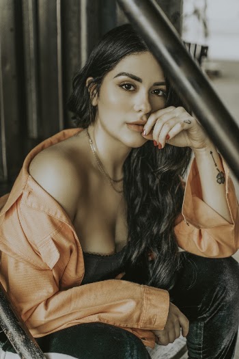 Photo of Woman Wearing Orange Dress Shirt