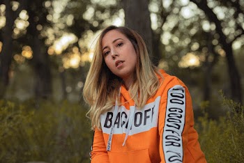 Photo Of Woman Wearing Orange Hoodie