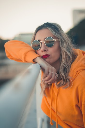 Photo Of Woman Wearing Orange Hoodie