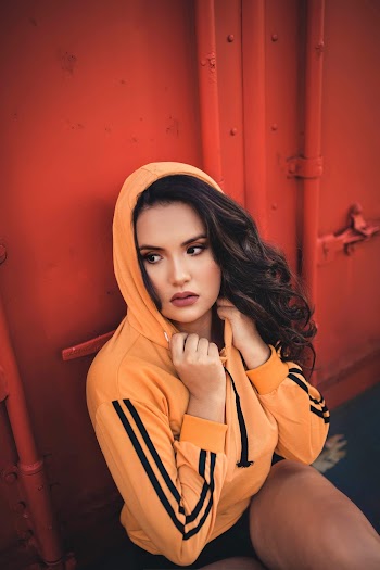 Photo of Woman Wearing Orange Jacket