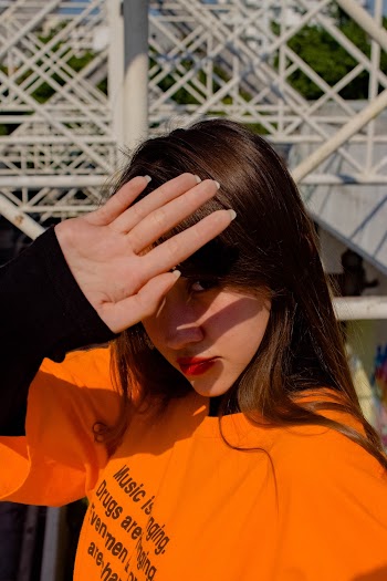 Photo Of Woman Wearing Orange Shirt