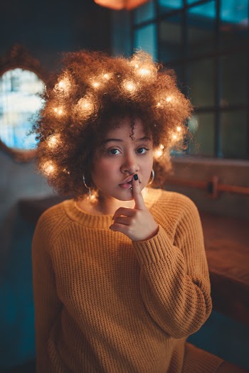 Photo Of Woman Wearing Orange Sweater