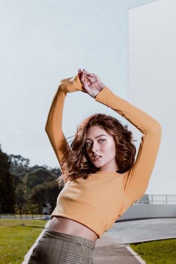 Photo Of Woman Wearing Orange Top