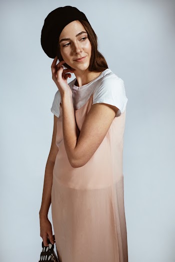 Photo of Woman Wearing Peach Dress