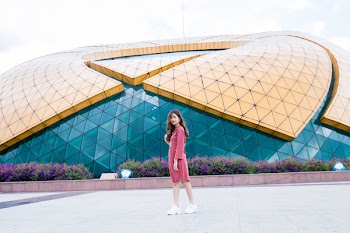 Photo of Woman Wearing Pink Long-sleeved Dress