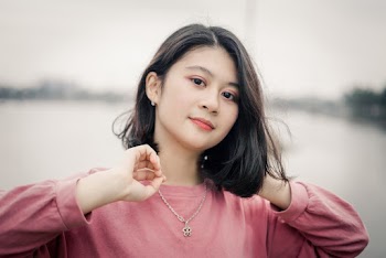 Photo of Woman Wearing Pink Sweater