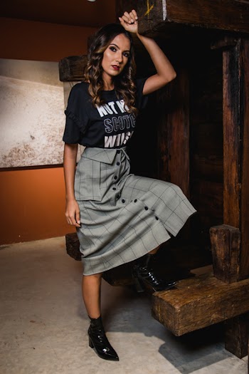 Photo of Woman Wearing Plaid Skirt