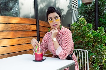 Photo of Woman Wearing Red and White Striped Dress