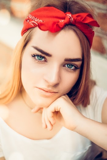Photo of Woman Wearing Red Bandana
